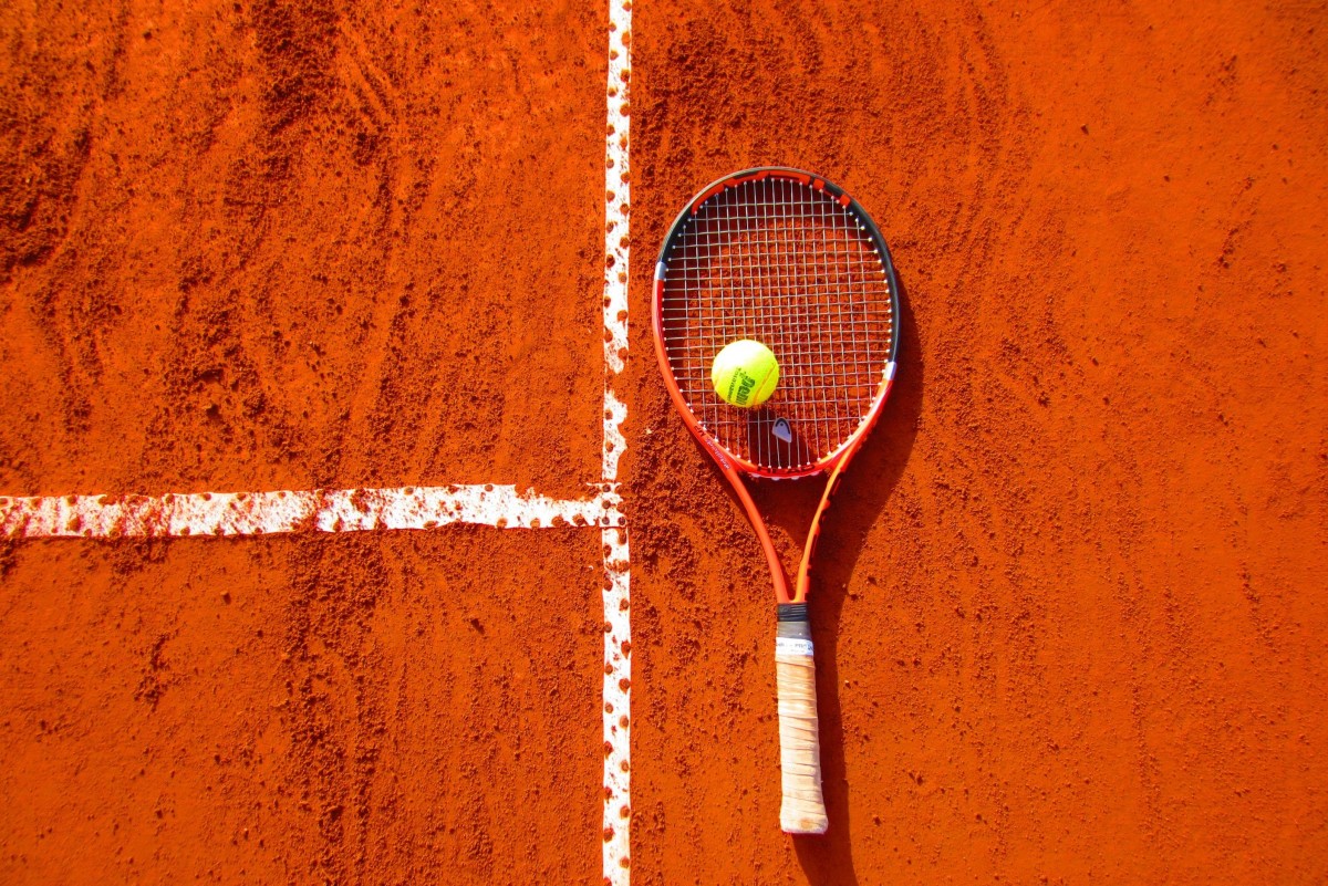 Tennis court, racket and ball